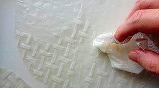 Brushing hot water to glue rice papers a little thicker.